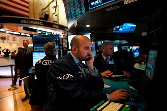 Des courtiers sur le plancher de la Bourse de New York.